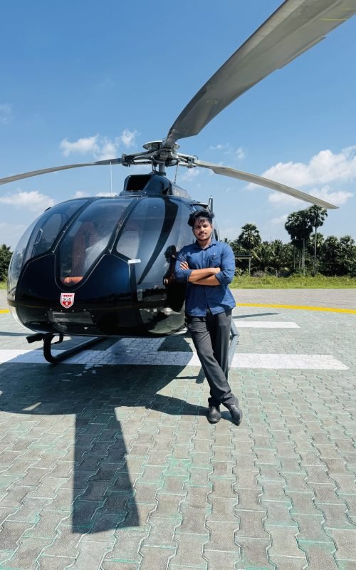ounder and Chairman of Nexus Catalyst standing near a private helicopter, representing leadership in aviation and future technologies